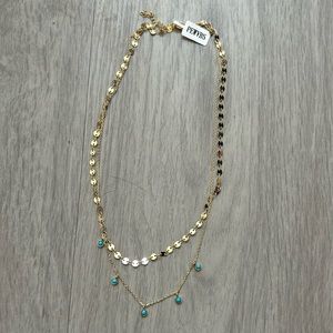Gold and blue dual necklace from charmed aroma candle
